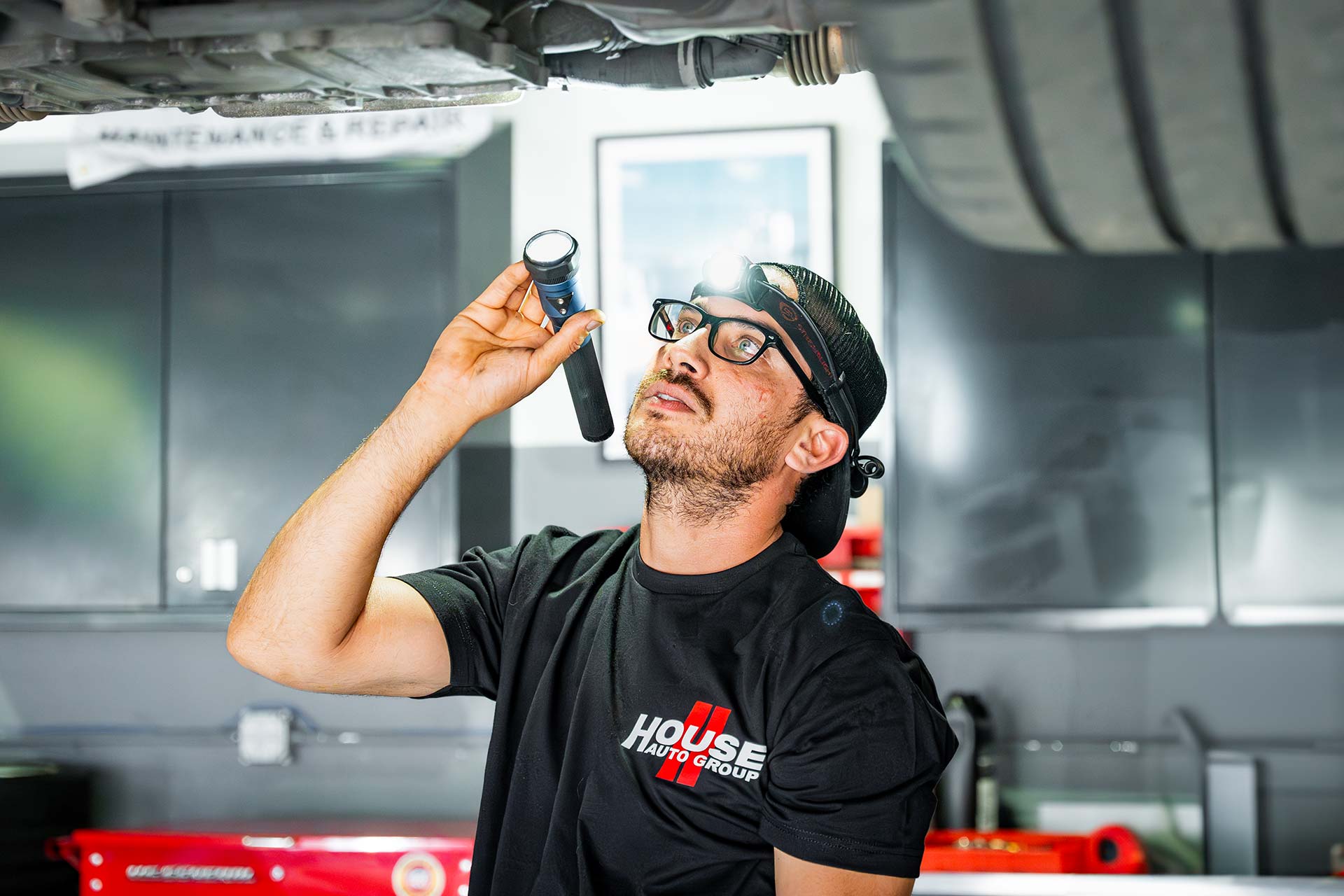 house auto tech working on porsche