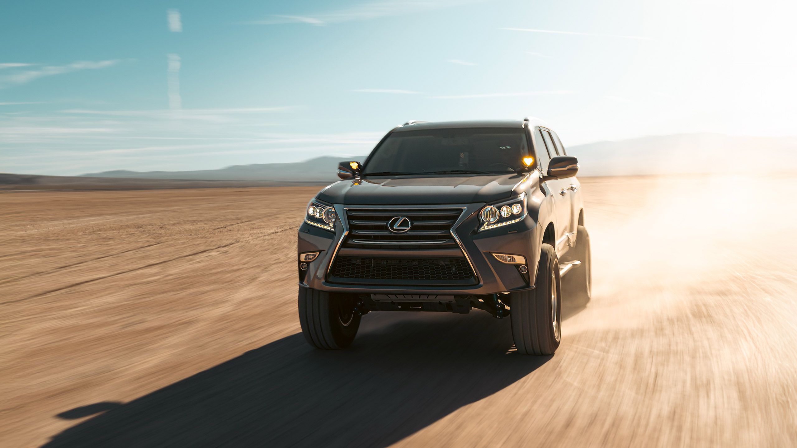 lexus gx460 off road build rolling shot in the desert
