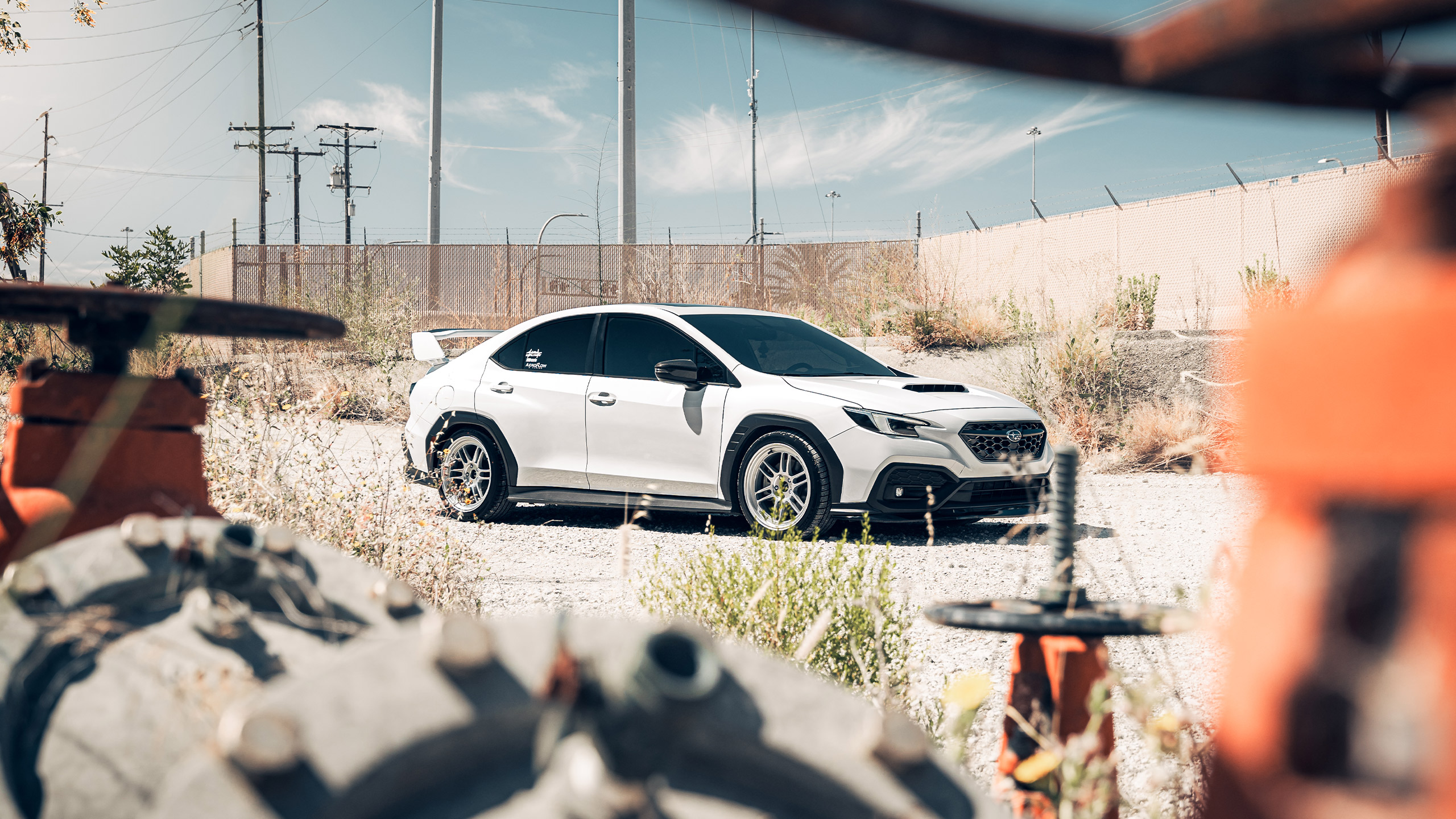 white subaru wrx vb in industrial setting